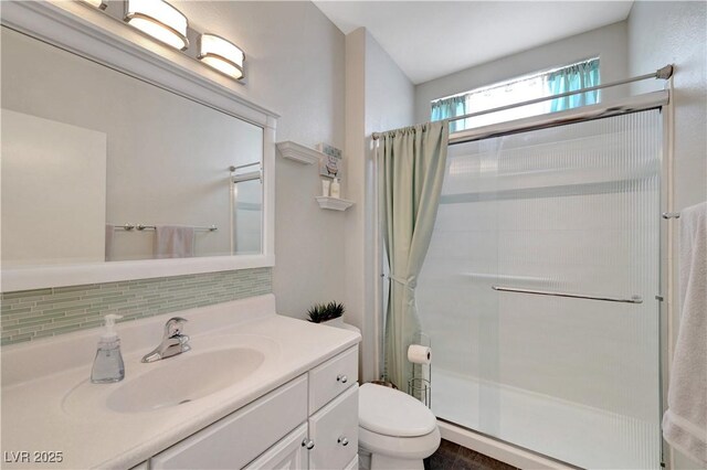 2805 Hanging Rock Dr, Las Vegas, NV 89134 - bathroom with a shower with curtain, toilet, decorative backsplash, and vanity