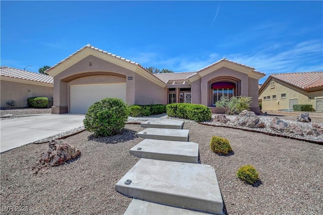 2805 Hanging Rock Dr, Las Vegas, NV 89134 - single story home featuring stucco siding, a garage, driveway, and a tile roof