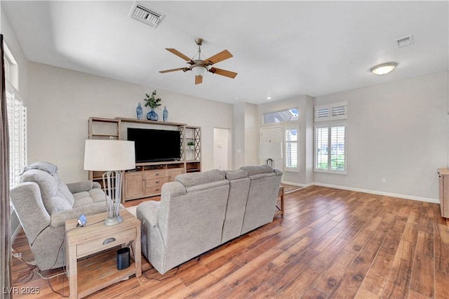 2805 Hanging Rock Dr, Las Vegas, NV 89134 - living room with a ceiling fan, light wood-style floors, and baseboards