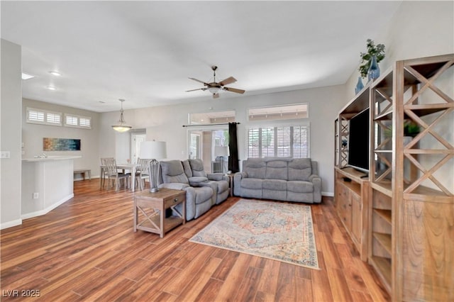 2805 Hanging Rock Dr, Las Vegas, NV 89134 - living area with plenty of natural light, wood finished floors, ceiling fan, baseboards, and recessed lighting