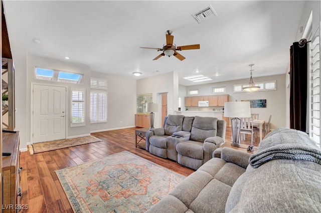 2805 Hanging Rock Dr, Las Vegas, NV 89134 - living room with hardwood / wood-style flooring, plenty of natural light, ceiling fan, baseboards, and recessed lighting