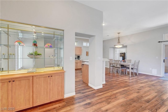 2805 Hanging Rock Dr, Las Vegas, NV 89134 - kitchen featuring light wood-style floors, baseboards, light countertops, and recessed lighting