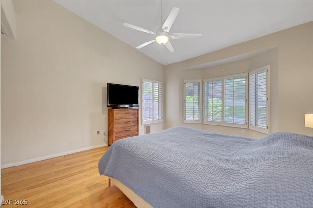2805 Hanging Rock Dr, Las Vegas, NV 89134 - bedroom with light wood-style floors, baseboards, ceiling fan, and high vaulted ceiling