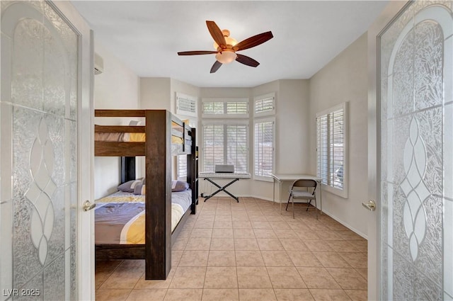 2805 Hanging Rock Dr, Las Vegas, NV 89134 - bedroom with light tile patterned flooring, baseboards, and a ceiling fan