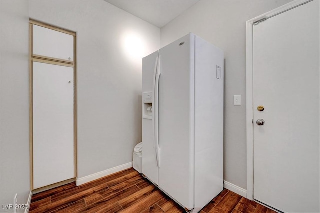 2805 Hanging Rock Dr, Las Vegas, NV 89134 - unfurnished bedroom featuring white fridge with ice dispenser, wood finished floors, and baseboards
