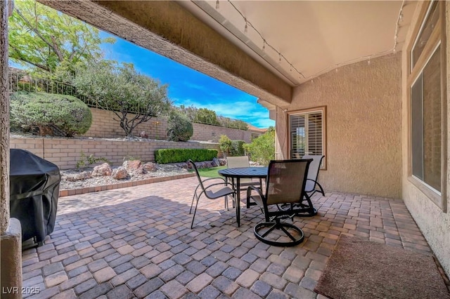 2805 Hanging Rock Dr, Las Vegas, NV 89134 - fenced backyard featuring outdoor dining space, a patio, and a grill