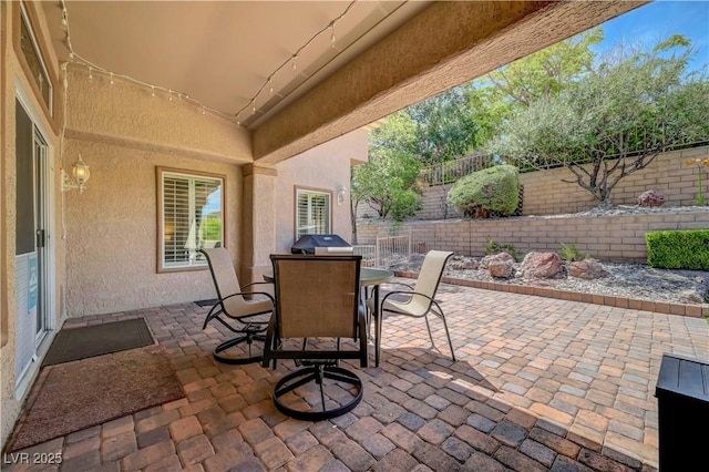 2805 Hanging Rock Dr, Las Vegas, NV 89134 - fenced backyard with a patio area, outdoor dining space, and a grill