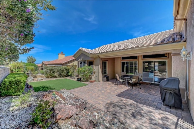 2805 Hanging Rock Dr, Las Vegas, NV 89134 - fenced backyard with a patio area