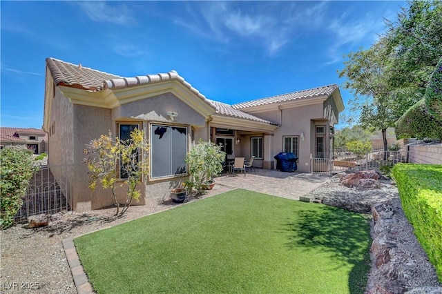 2805 Hanging Rock Dr, Las Vegas, NV 89134 - back of property with a patio area, a tile roof, and stucco siding