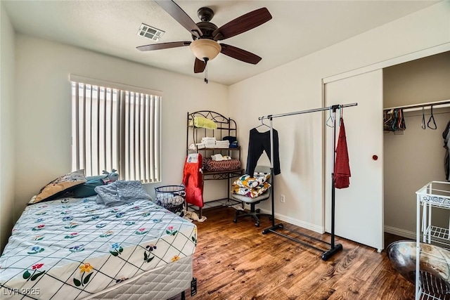 4832 Englewood Ave, Las Vegas, NV 89139 - bedroom with wood finished floors, a closet, ceiling fan, and baseboards