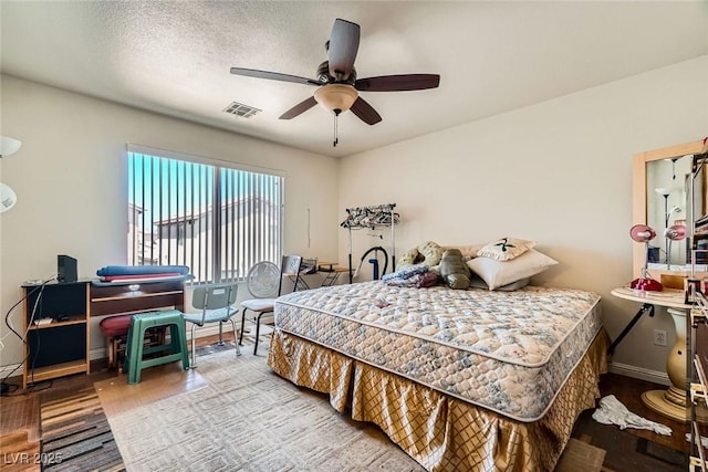 4832 Englewood Ave, Las Vegas, NV 89139 - bedroom with wood finished floors, baseboards, and a ceiling fan