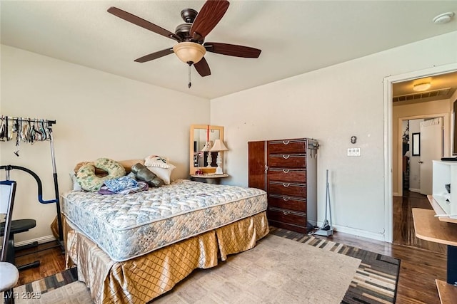 4832 Englewood Ave, Las Vegas, NV 89139 - bedroom with wood finished floors, a ceiling fan, and baseboards