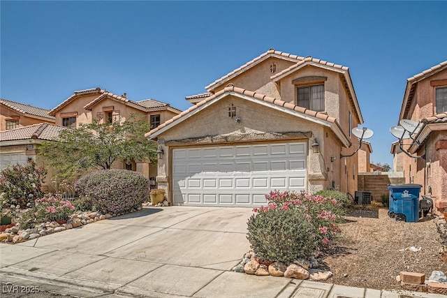 4832 Englewood Ave, Las Vegas, NV 89139 - view of front of house with driveway, a tiled roof, stucco siding, and a garage