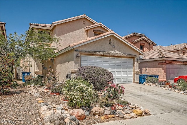 4832 Englewood Ave, Las Vegas, NV 89139 - mediterranean / spanish house featuring driveway, an attached garage, a tile roof, and stucco siding