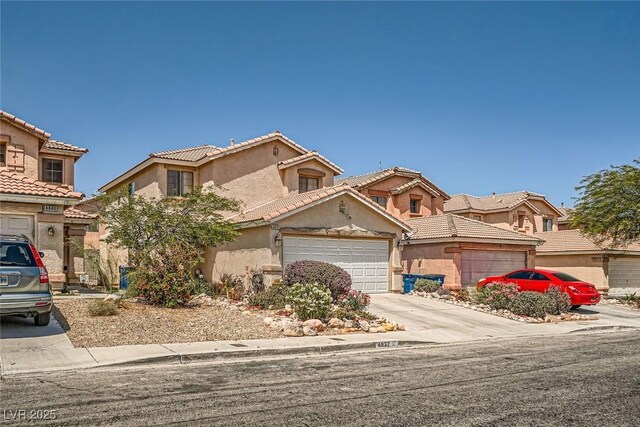 4832 Englewood Ave, Las Vegas, NV 89139 - view of front of home featuring a garage, stucco siding, driveway, and a tile roof
