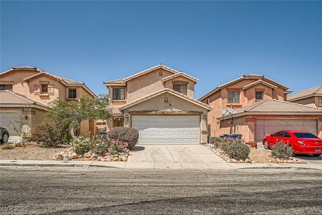 4832 Englewood Ave, Las Vegas, NV 89139 - view of front of house with concrete driveway, stucco siding, and a tiled roof