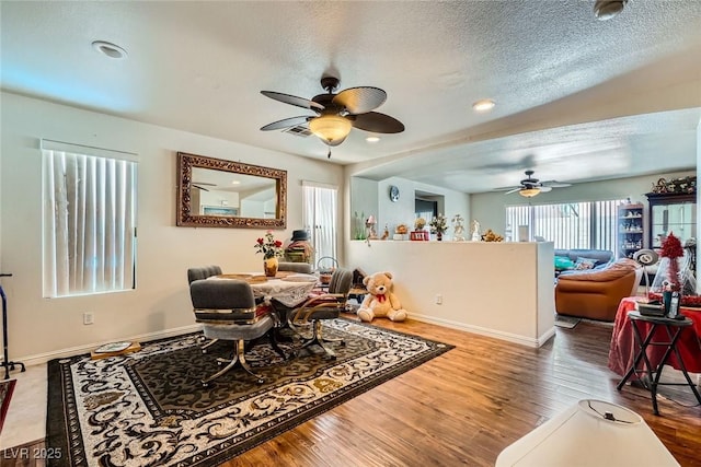 4832 Englewood Ave, Las Vegas, NV 89139 - dining space with ceiling fan, plenty of natural light, wood finished floors, a textured ceiling, and recessed lighting