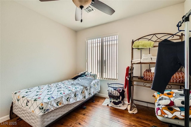 4832 Englewood Ave, Las Vegas, NV 89139 - bedroom with wood finished floors, baseboards, and a ceiling fan
