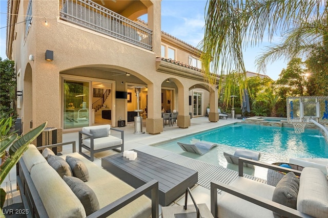 2240 Boutique Ave, Henderson, NV 89044 - view of swimming pool featuring an outdoor living space, a patio area, and a pool with connected hot tub