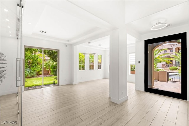 2240 Boutique Ave, Henderson, NV 89044 - foyer entrance featuring baseboards, a tray ceiling, and light wood-style flooring