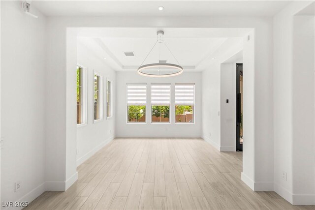 2240 Boutique Ave, Henderson, NV 89044 - unfurnished room featuring light wood-style flooring, baseboards, a tray ceiling, and recessed lighting