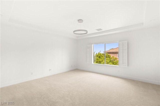 2240 Boutique Ave, Henderson, NV 89044 - unfurnished room featuring a raised ceiling, light carpet, and baseboards