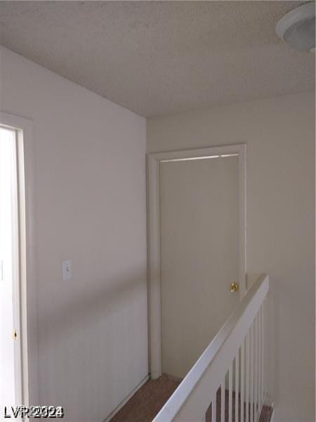 4760 Woodridge Rd, Las Vegas, NV 89121 - hallway with an upstairs landing