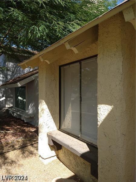4760 Woodridge Rd, Las Vegas, NV 89121 - view of side of property featuring stucco siding