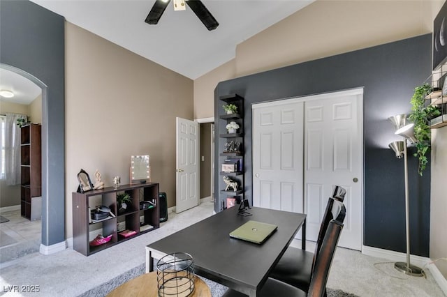 5509 Ante Up Ct Unit 102, Las Vegas, NV 89122 - office area featuring arched walkways, light colored carpet, a ceiling fan, baseboards, and high vaulted ceiling