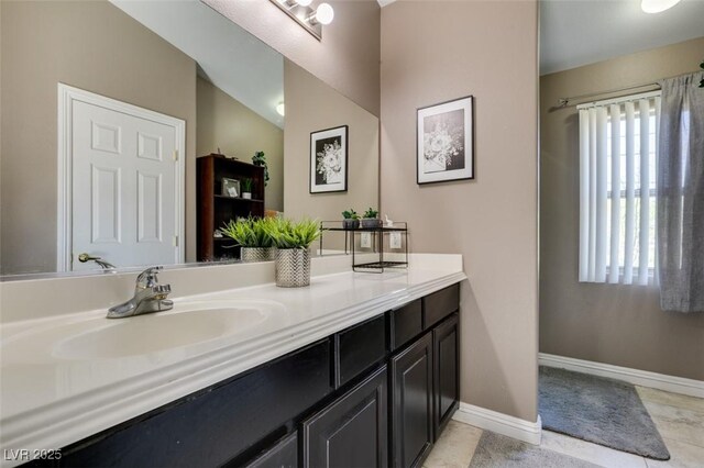 5509 Ante Up Ct Unit 102, Las Vegas, NV 89122 - bathroom featuring vanity, baseboards, and tile patterned floors