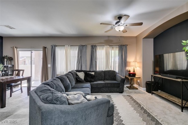 5509 Ante Up Ct Unit 102, Las Vegas, NV 89122 - carpeted living room with ceiling fan and baseboards