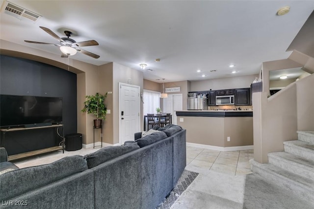 5509 Ante Up Ct Unit 102, Las Vegas, NV 89122 - living area with a ceiling fan, stairway, light marble finish flooring, baseboards, and recessed lighting