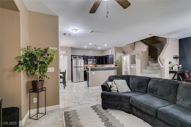 5509 Ante Up Ct Unit 102, Las Vegas, NV 89122 - living area with stairway, ceiling fan, and baseboards