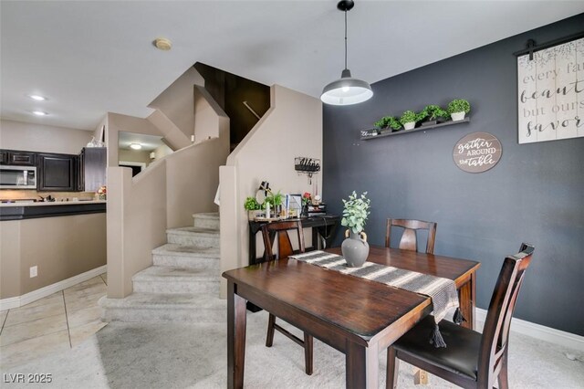 5509 Ante Up Ct Unit 102, Las Vegas, NV 89122 - dining room with stairway and baseboards