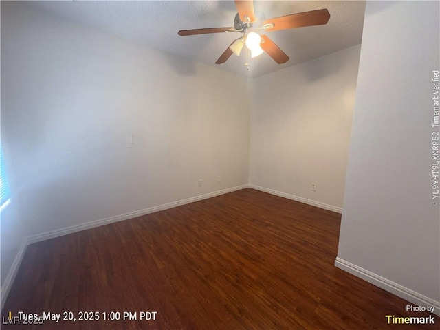 unfurnished room with wood finished floors, baseboards, and a ceiling fan