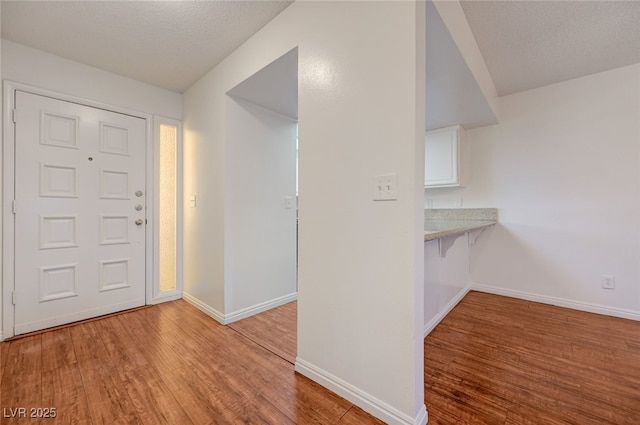 1850 Camino Verde Ln, Las Vegas, NV 89119 - entrance foyer featuring wood finished floors and a textured ceiling