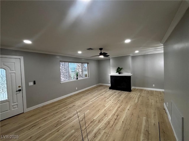 150 Greenbriar Townhouse Way, Las Vegas, NV 89121 - unfurnished living room with crown molding, a ceiling fan, recessed lighting, light wood-style floors, and baseboards