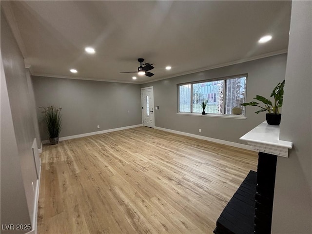 150 Greenbriar Townhouse Way, Las Vegas, NV 89121 - unfurnished living room with ornamental molding, recessed lighting, light wood-style floors, ceiling fan, and baseboards