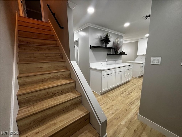150 Greenbriar Townhouse Way, Las Vegas, NV 89121 - stairs with crown molding, wood finished floors, recessed lighting, and baseboards