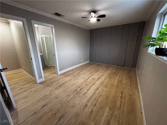 150 Greenbriar Townhouse Way, Las Vegas, NV 89121 - unfurnished bedroom featuring light wood finished floors, ornamental molding, baseboards, a ceiling fan, and connected bathroom
