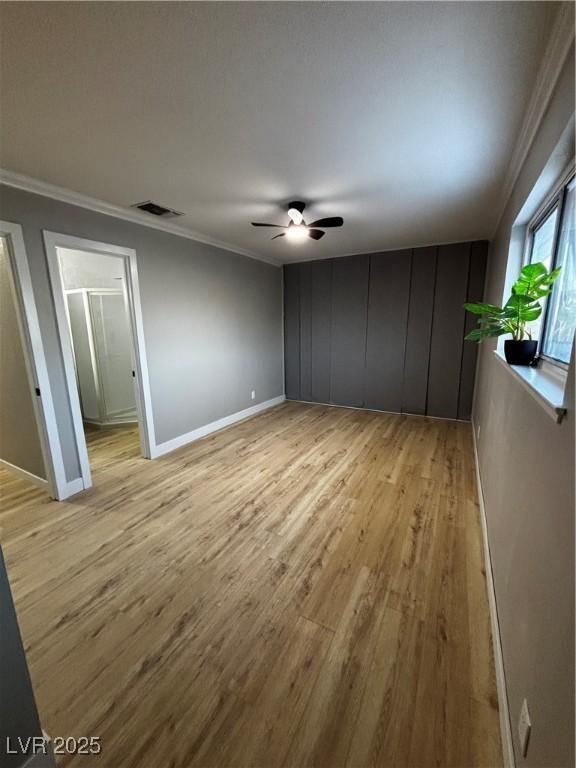 150 Greenbriar Townhouse Way, Las Vegas, NV 89121 - spare room with ornamental molding, light wood-type flooring, baseboards, and ceiling fan