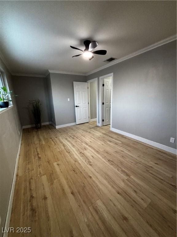 150 Greenbriar Townhouse Way, Las Vegas, NV 89121 - unfurnished room with light wood-type flooring, a ceiling fan, baseboards, and ornamental molding