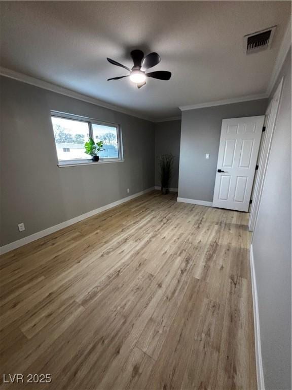 150 Greenbriar Townhouse Way, Las Vegas, NV 89121 - unfurnished bedroom with ornamental molding, wood finished floors, baseboards, and a ceiling fan