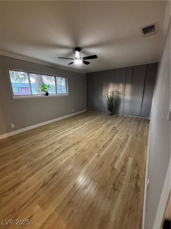 150 Greenbriar Townhouse Way, Las Vegas, NV 89121 - unfurnished room with light wood-style flooring, ceiling fan, and baseboards