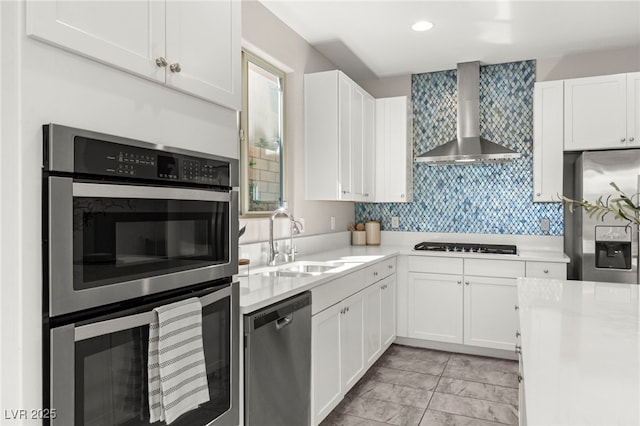 11847 Corenzio Ave, Las Vegas, NV 89138 - kitchen with appliances with stainless steel finishes, wall chimney exhaust hood, light countertops, white cabinets, and recessed lighting