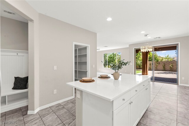 11847 Corenzio Ave, Las Vegas, NV 89138 - kitchen featuring plenty of natural light, a center island, white cabinetry, light countertops, and recessed lighting