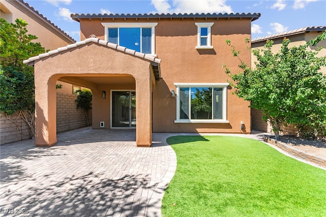 11847 Corenzio Ave, Las Vegas, NV 89138 - rear view of house with stucco siding, a patio area, and a tiled roof