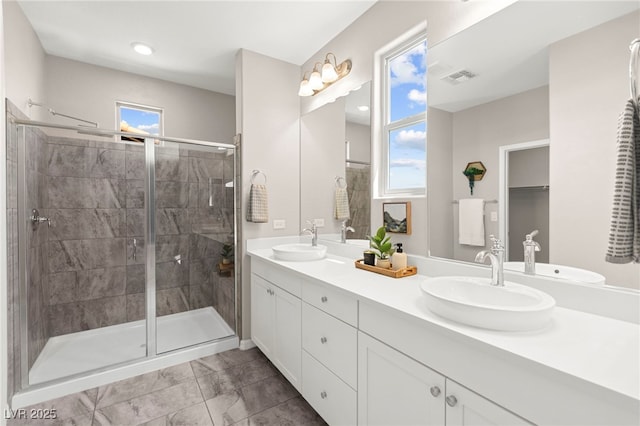 11847 Corenzio Ave, Las Vegas, NV 89138 - full bathroom featuring a stall shower and double vanity