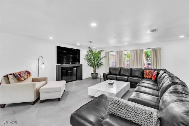 3189 Montecito Dr, Las Vegas, NV 89120 - living area with recessed lighting, a glass covered fireplace, and finished concrete floors