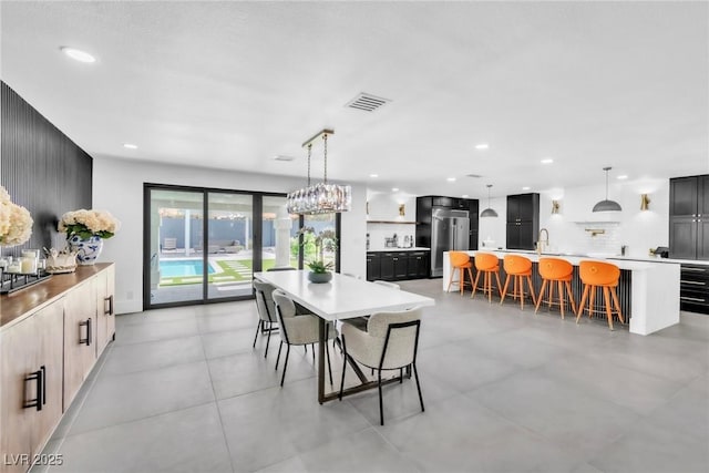 3189 Montecito Dr, Las Vegas, NV 89120 - dining space featuring recessed lighting and a chandelier
